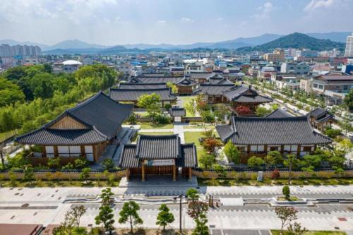 an overhead view of a city with buildings at Hanok Stay Namwonyechon by Kensington in Namwon