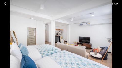 a living room with a couch and a tv at 168 House 3B Near BTS iconsiam in Godown