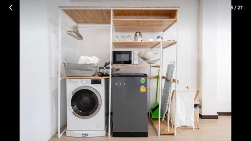 a laundry room with a washer and dryer at 168 House 3B Near BTS iconsiam in Godown