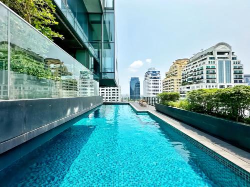 a swimming pool in the middle of a building at Circle Sukhumvit 11 Bangkok in Bangkok