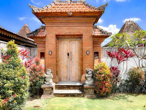 Κήπος έξω από το Seseh Beach Bungalows - Adults Only