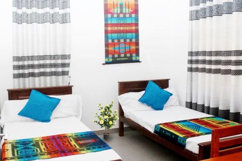 Postel nebo postele na pokoji v ubytování Adi Residences