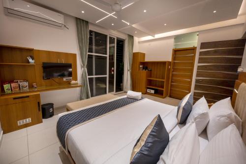 Un ou plusieurs lits dans un hébergement de l'établissement S R Spa Suites