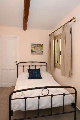 Ένα ή περισσότερα κρεβάτια σε δωμάτιο στο Elida Inn Near ATH Airport