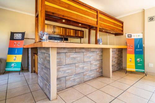 a kitchen with a counter top in a room at ATKV Natalia in Kingsburgh