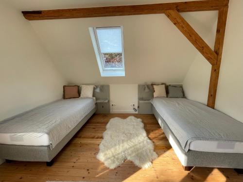 Katil atau katil-katil dalam bilik di Ferienhaus NORDLICHT