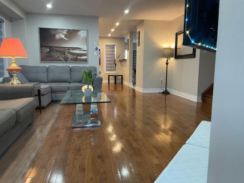 a living room with a couch and a table at Finesse in Whitby
