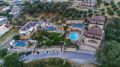 an aerial view of a house with a yard at Asion Lithos in Kato Asites