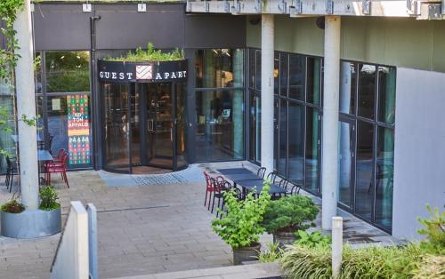 an entrance to a building with a table and chairs at Hotel GUESTapart in Aarhus