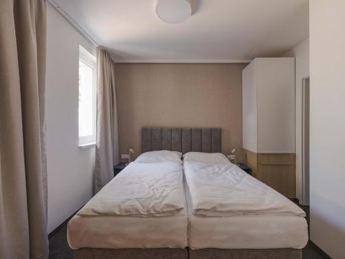 Кровать или кровати в номере Hotel Taxis Bratislava - New rooms