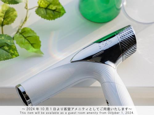 a toothbrush sitting on top of a white sink at The Park Front Hotel at Universal Studios Japan in Osaka