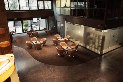 an overhead view of a room with chairs in a building at Hotel City Maribor in Maribor