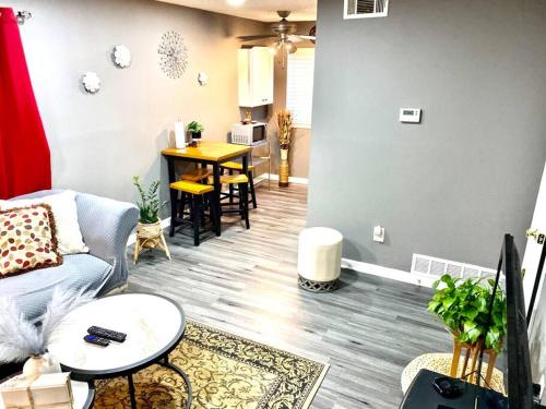 a living room with a couch and a table at Welcome International Guests-Medical Residents-free shuttle downtown-full kitchen- free parking in Memphis