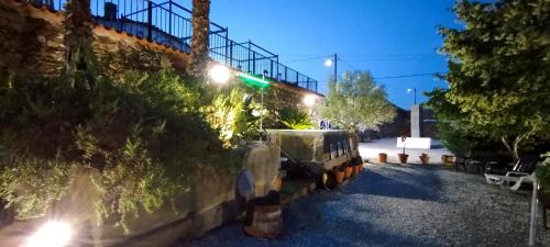a street light on a building at night at ROSA XVI - Garden Guest House in Vilar Torpim
