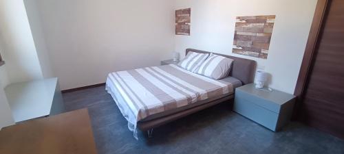 Postel nebo postele na pokoji v ubytování a casa di ASIA