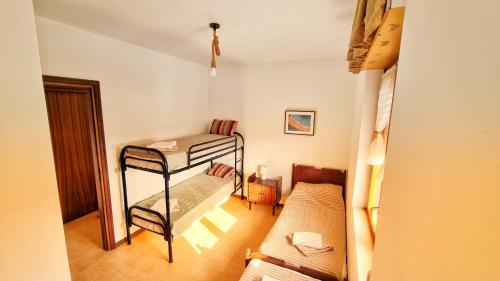 Ένα ή περισσότερα κρεβάτια σε δωμάτιο στο Relaxing italian seaside apartment