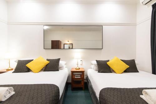 Una cama o camas en una habitación de Grande Escape Resort