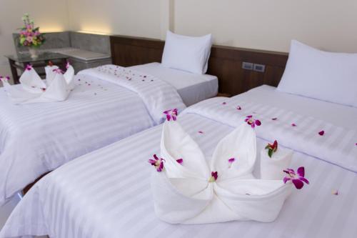 Postelja oz. postelje v sobi nastanitve Suksompong Resort