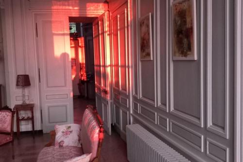 a living room with a couch and a chair at Chateau de Joudes Suite de la Baronne in Joudes