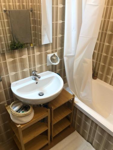 a bathroom with a sink and a bath tub at Fior di Loto in Ravenna