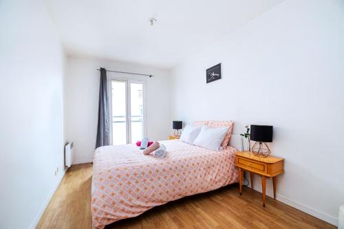 Ένα ή περισσότερα κρεβάτια σε δωμάτιο στο Cosy & Spacieux, Paris 10 min + Parking privé.