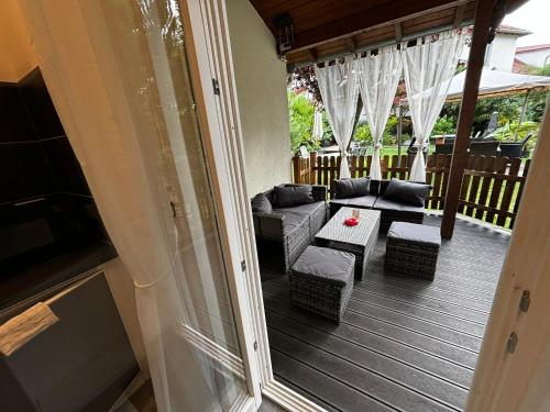a screened in porch with a couch and a table at Residenz Royal in Sandhausen