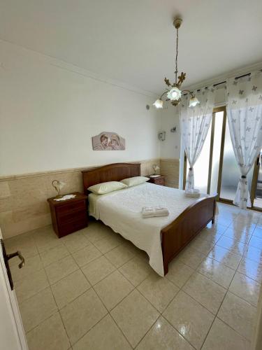 Ένα ή περισσότερα κρεβάτια σε δωμάτιο στο Casa Rilù