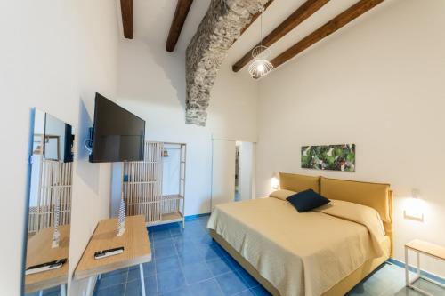 Postel nebo postele na pokoji v ubytování Archi Suite Canneto