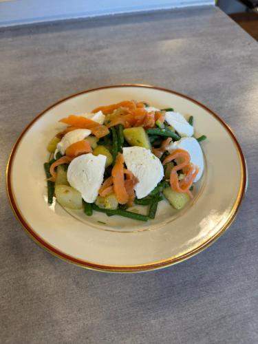 a plate of food with vegetables on a table at Belgica-Melay 52400 in Melay
