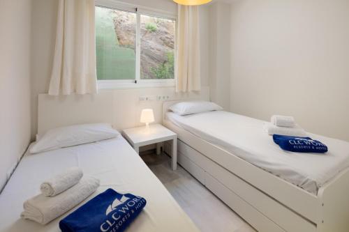 Postel nebo postele na pokoji v ubytování Coloso Sunset Beach by Alfresco Stays