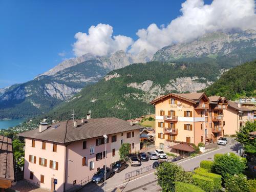 a view of a town with mountains in the background at Mansarda Belvedere in Molveno