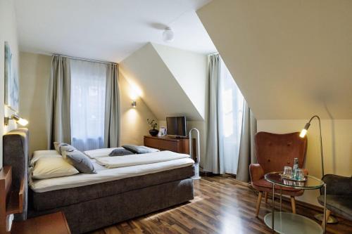 Postel nebo postele na pokoji v ubytování Flair Hotel Hopfengarten
