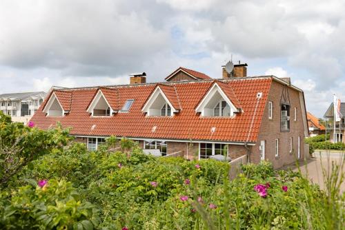 an old brick building with an orange roof at Fernweh in List