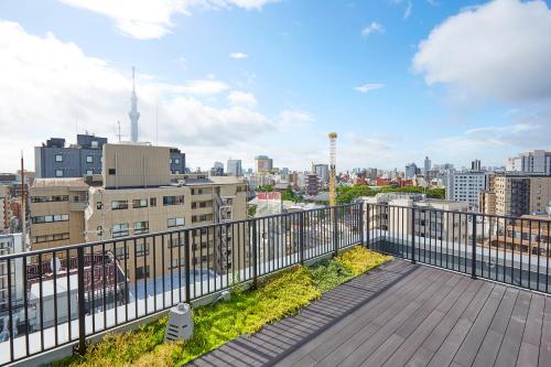 a balcony with a view of a city at hotel MONday Asakusa in Tokyo