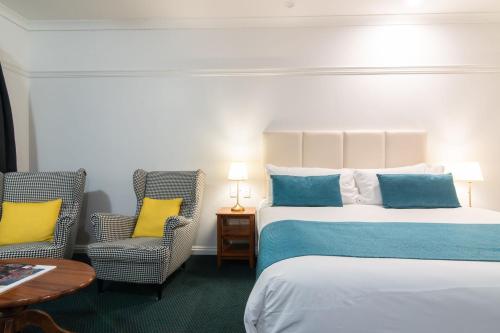 Una cama o camas en una habitación de Grande Escape Resort
