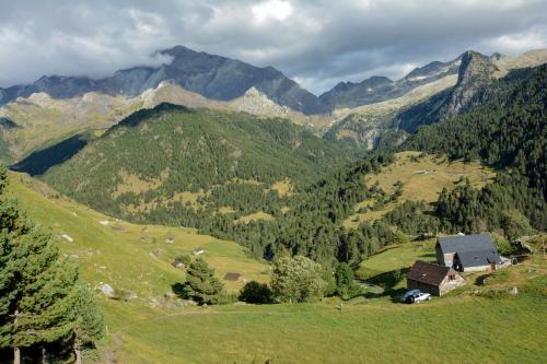 a house on a hill in a valley with mountains at La Bordeta Serena - Casa Toño in San Juan de Plan