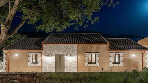 a house at night with lights on at Fiscardo Sunny Villas in Fiskardho