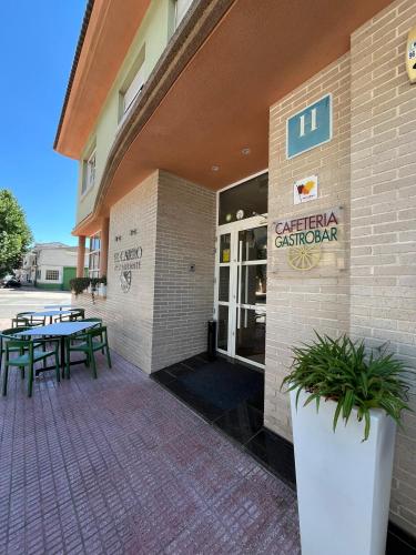 a building with a picnic table outside of it at PENSIÓN EL CARRO in Utiel