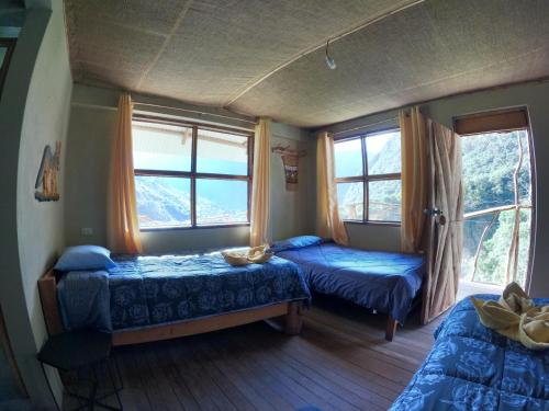 Voodi või voodid majutusasutuse Salkantay Hostel Chaullay toas