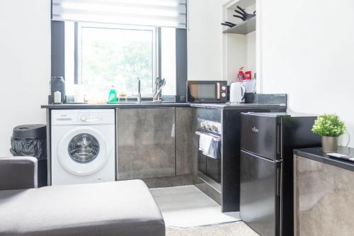 Nhà bếp/bếp nhỏ tại Renton Apartment
