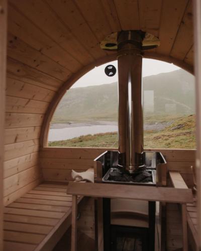 a small room with a window in a wooden cabin at Barlwyd Glamping in Blaenau-Ffestiniog
