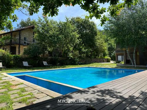 a swimming pool in the backyard of a house at Moleiro da Costa Má in Sever do Vouga