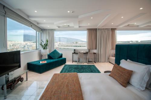 Posteľ alebo postele v izbe v ubytovaní Athenaeum Grand Hotel