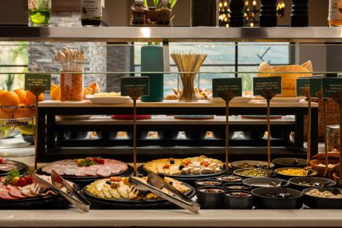 a buffet with many different types of food on display at Burchmulla Resorts in Burchmulla