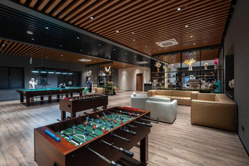 a lobby with a pool table and a billiard room at Burchmulla Resorts in Burchmulla