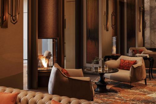 a living room with a couch and chairs and a table at One&Only Portonovi in Herceg-Novi