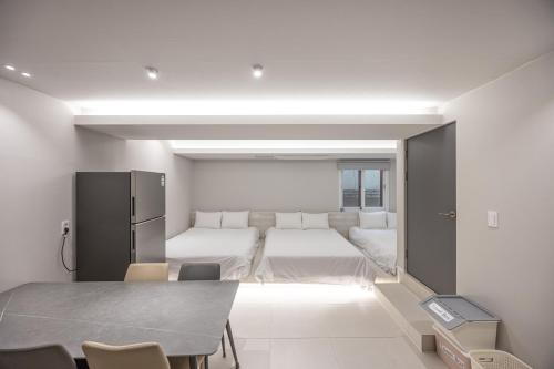 Ένα ή περισσότερα κρεβάτια σε δωμάτιο στο Guesthouse Dear Moon