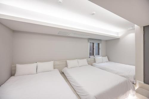 Ένα ή περισσότερα κρεβάτια σε δωμάτιο στο Guesthouse Dear Moon