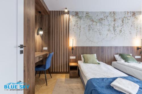 Voodi või voodid majutusasutuse Apartamenty BlueSky Kąpielowa 5C - z widokiem na góry, blisko wyciągów i szlaków turystycznych toas