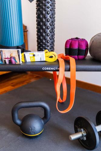 an orange ribbon is on a shelf with weights at Hotel La Piazzetta in Castellammare del Golfo